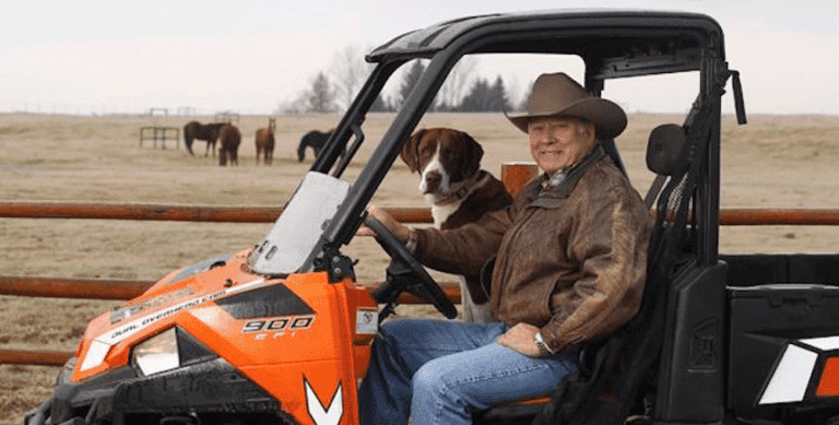 Frank VanderSloot and dog in an ATV
